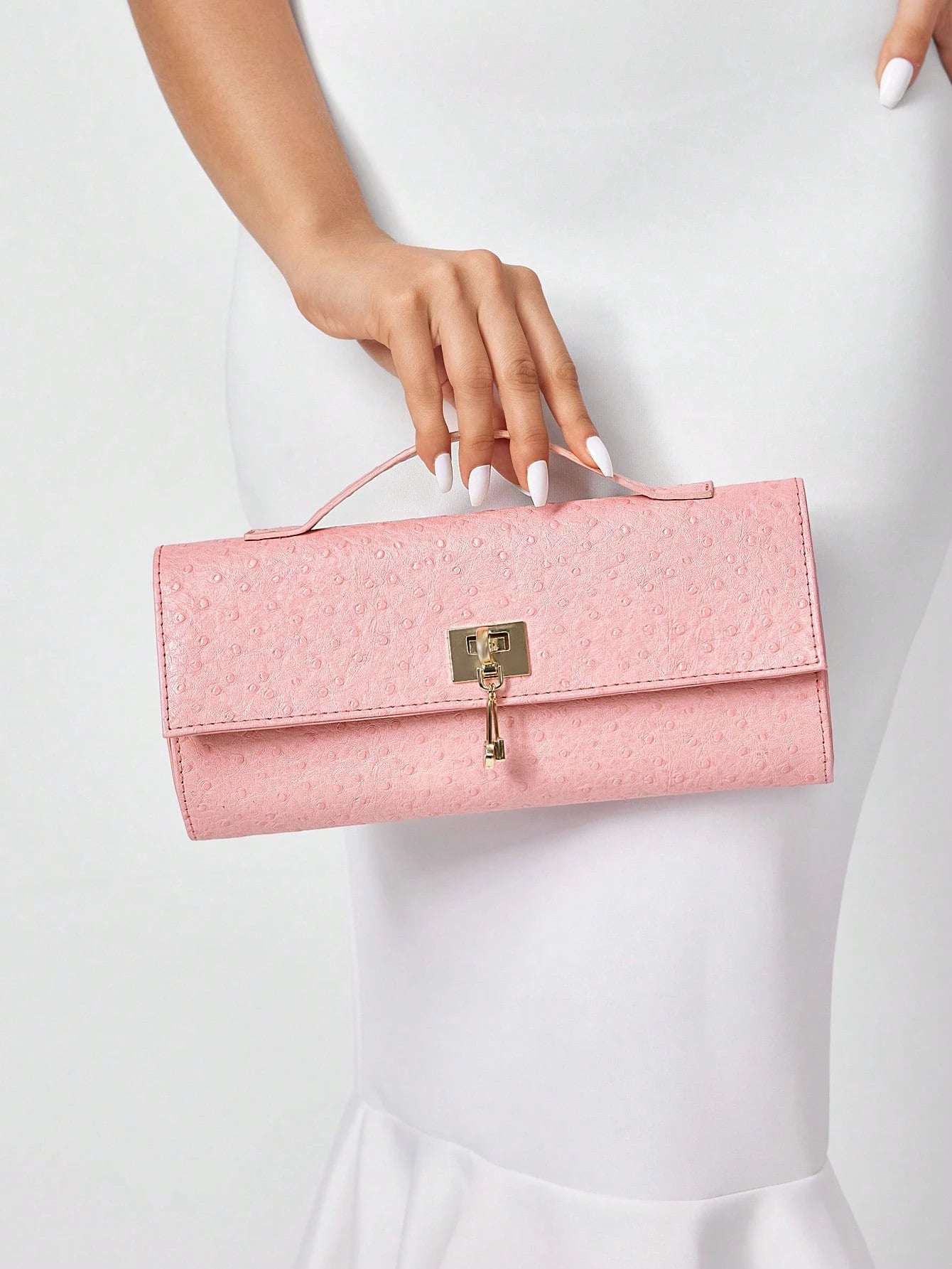 Blush Luxe Lock Clutch – Textured Pink.